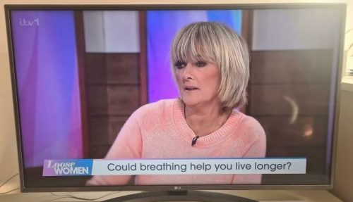 Woman on TV show with words reading 'Could breathing help you live longer?'