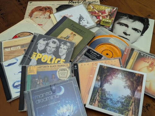 Mixed records and CDs of various music artists