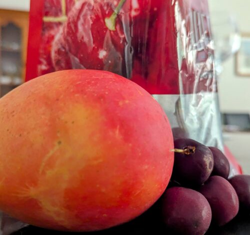 Mango and a bag of cherries